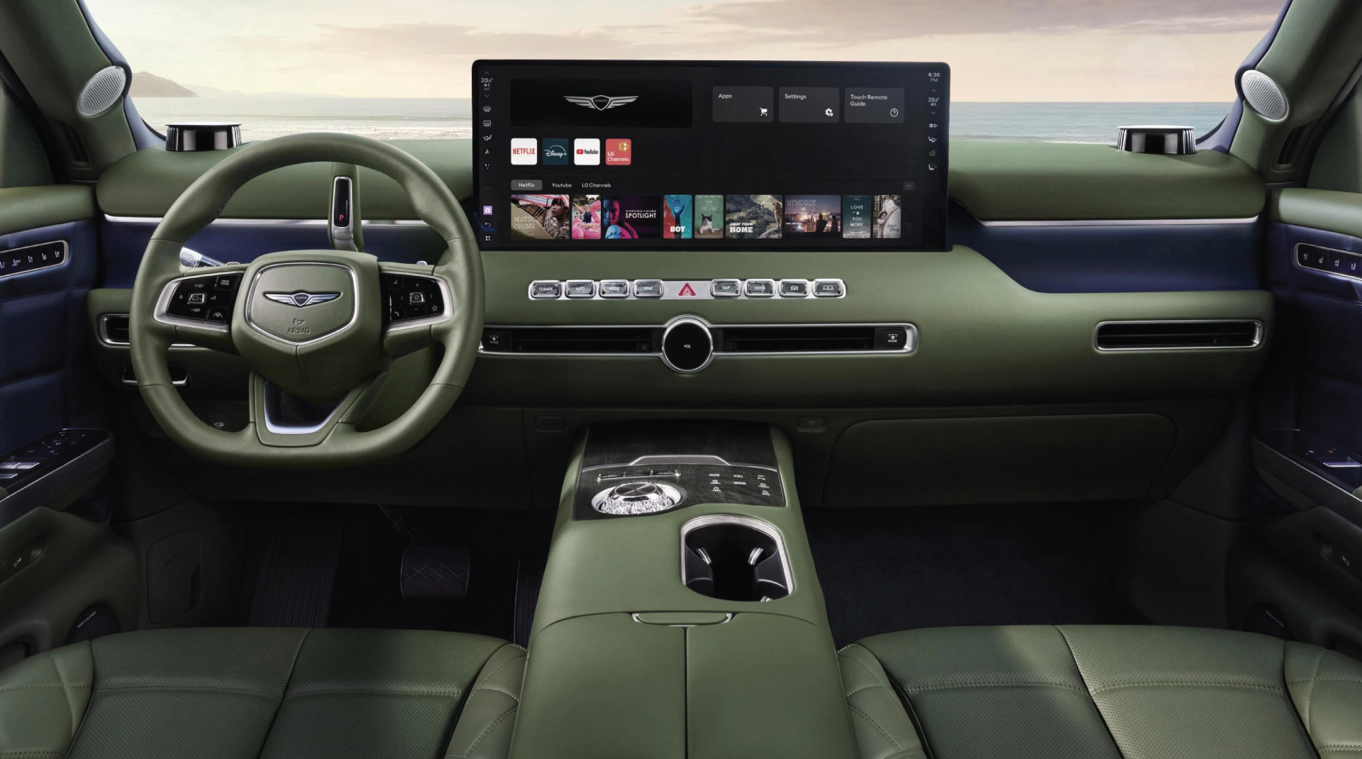 Green car interior with large digital screen showing streaming apps, olive steering wheel, and subtle blue accents.